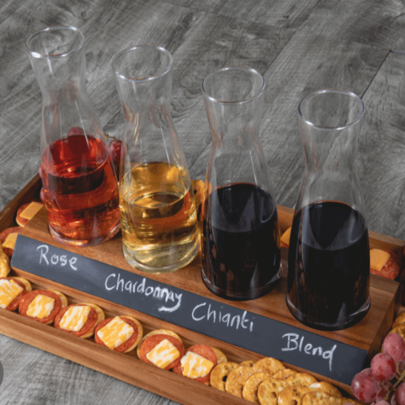 Cava Wine Tasting Kit-showing 4 carafes wine with their types written on a chalkboard on an acacia tray