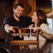 Craft Beer Flight Beverage Sampler - man and woman holding beer glasses