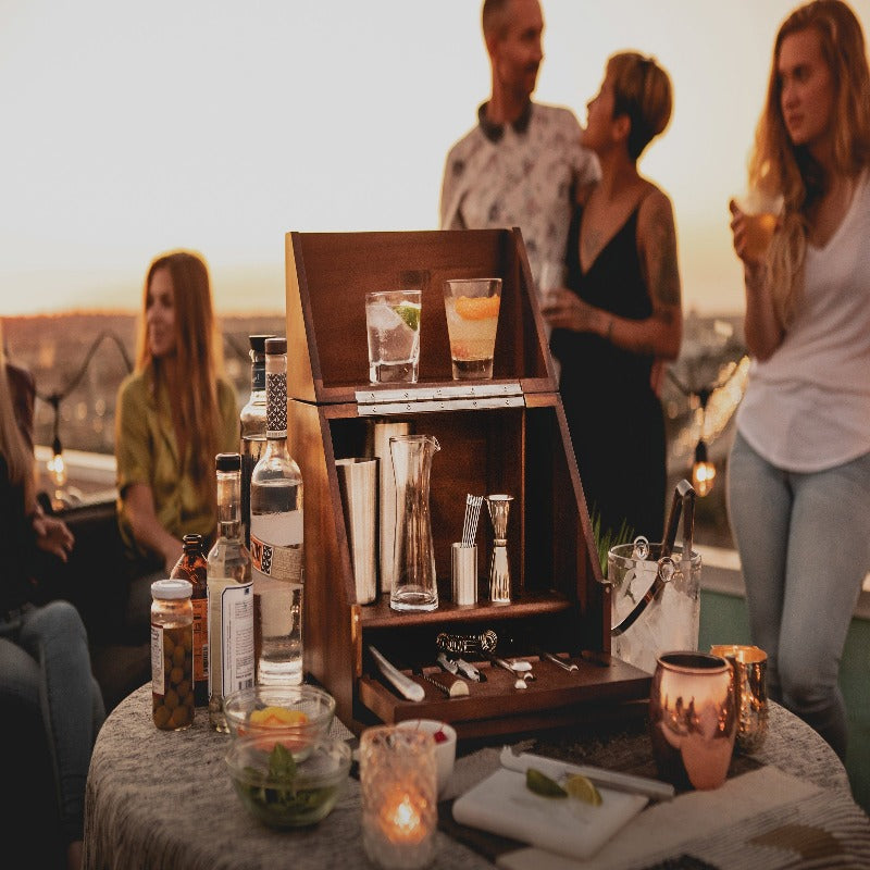 Legacy Madison Acacia Tabletop Bar Set - people at a party using the bar on top of a table