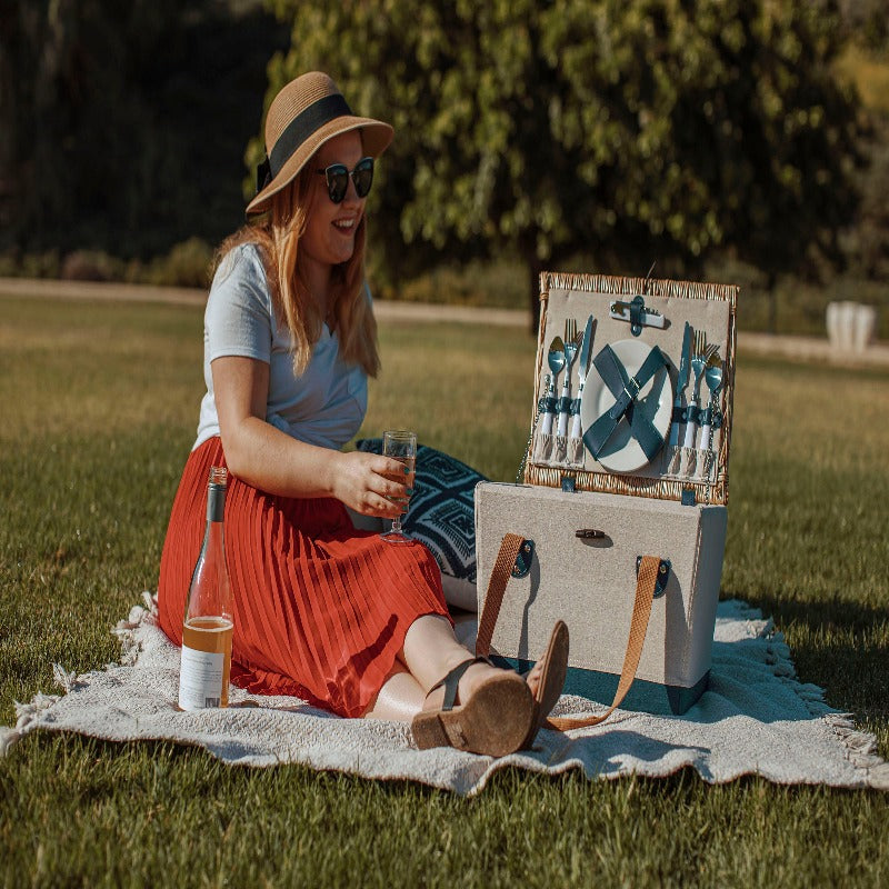 Picnic Time Boardwalk Picnic Basket for 2 - Woman sitting in the park with Picnic Basket