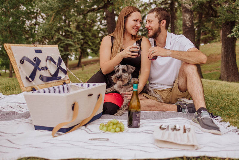 Picnic Time Boardwalk Picnic Basket for 4 - Beige - man and woman on a picnic with wine