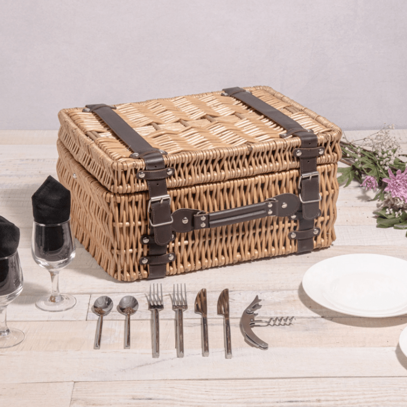 Picnic Time Champion Picnic Basket - Black with Brown Accents - Closed View of the Picnic Basket with Utensils around