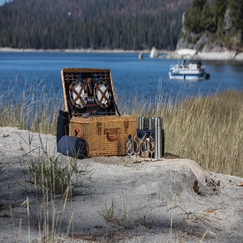 Picnic Time Windsor Picnic Basket - basket on a rock by the water