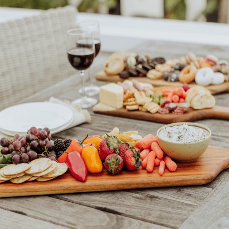 Toscana Artisan 30" Acacia Charcuterie Board - 3 charcuterie boards with appetizers and glasses of win