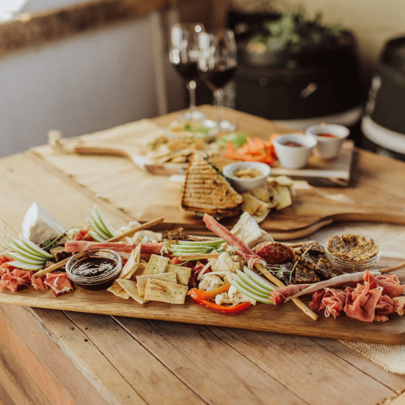 Toscana Artisan 30" Acacia Charcuterie Board - This chopping board can also double as a plate due to its length and unique design.