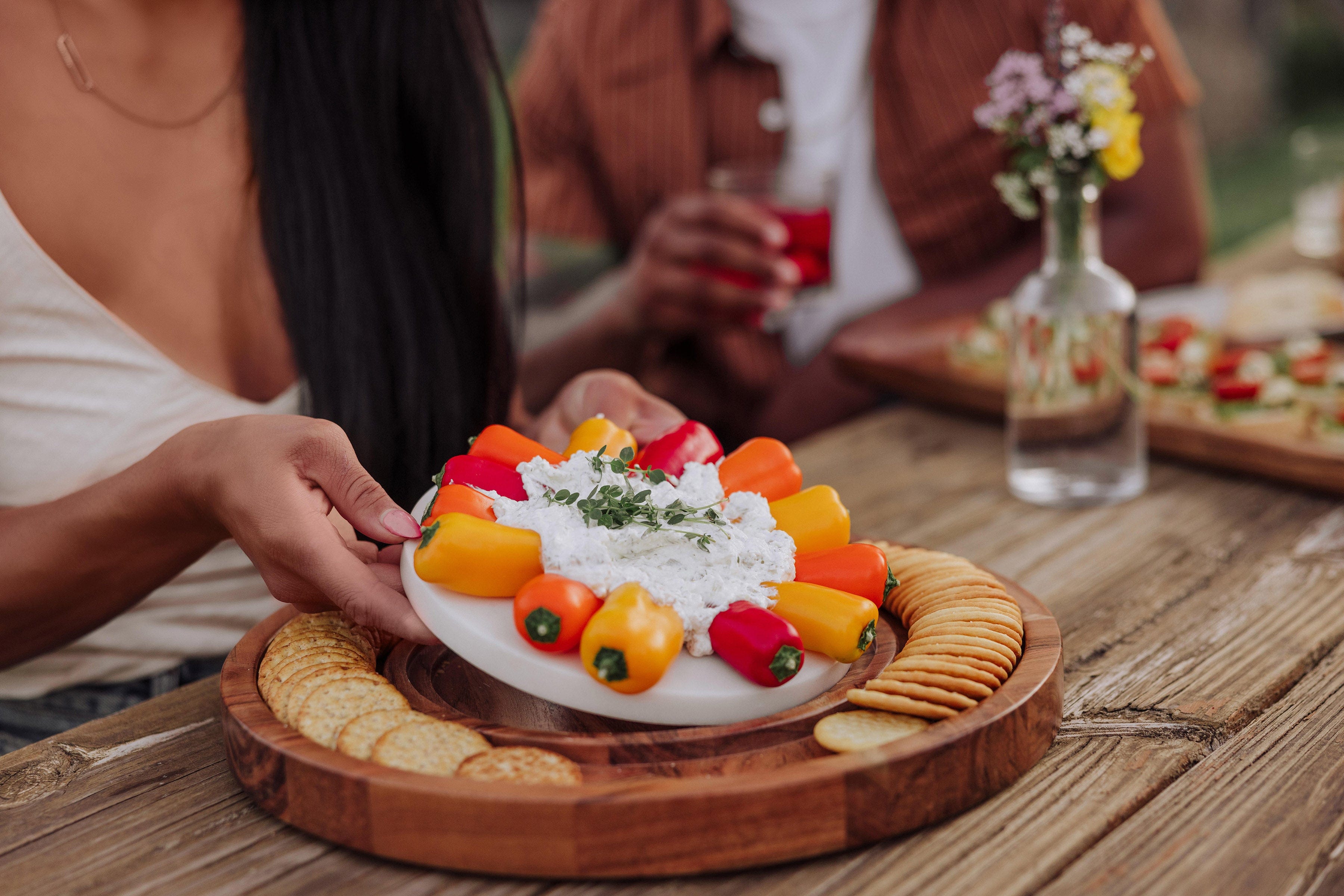 Toscana Isla Serving Platter with Marble Cheeseboard Insert - using board at a party